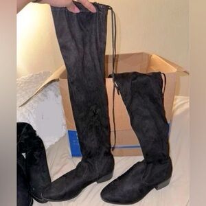 Black Thigh High boots.